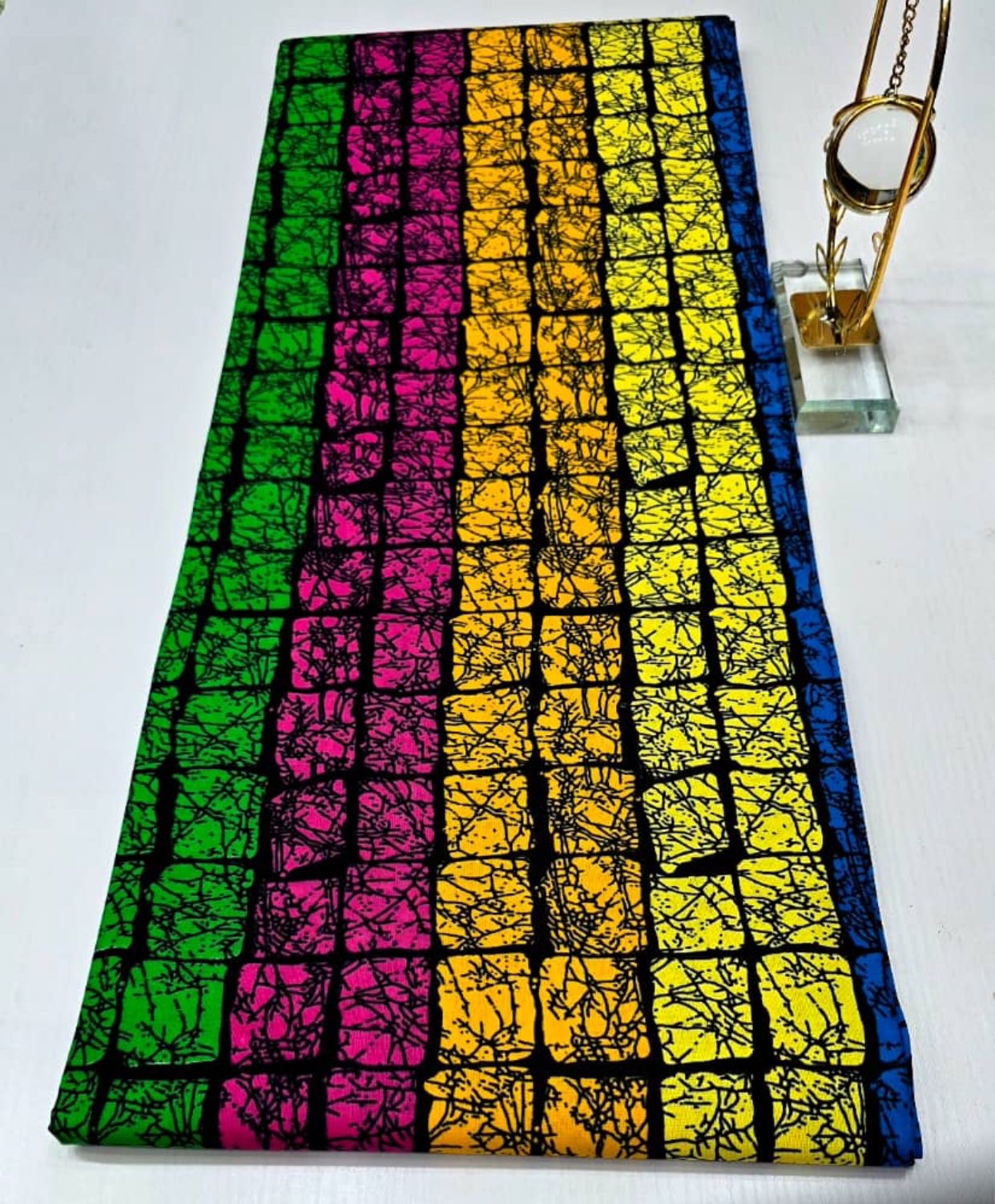 Colorful fabric with a grid pattern on a white background