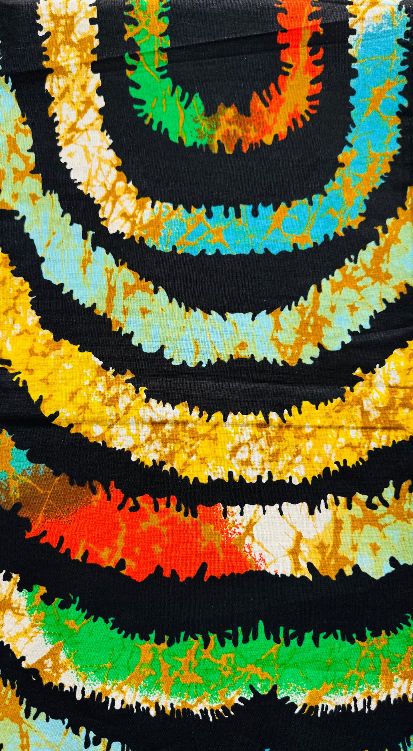 Tie-dye Pattern with Concentric Circles in Black, Orange, Yellow, Green, and Blue