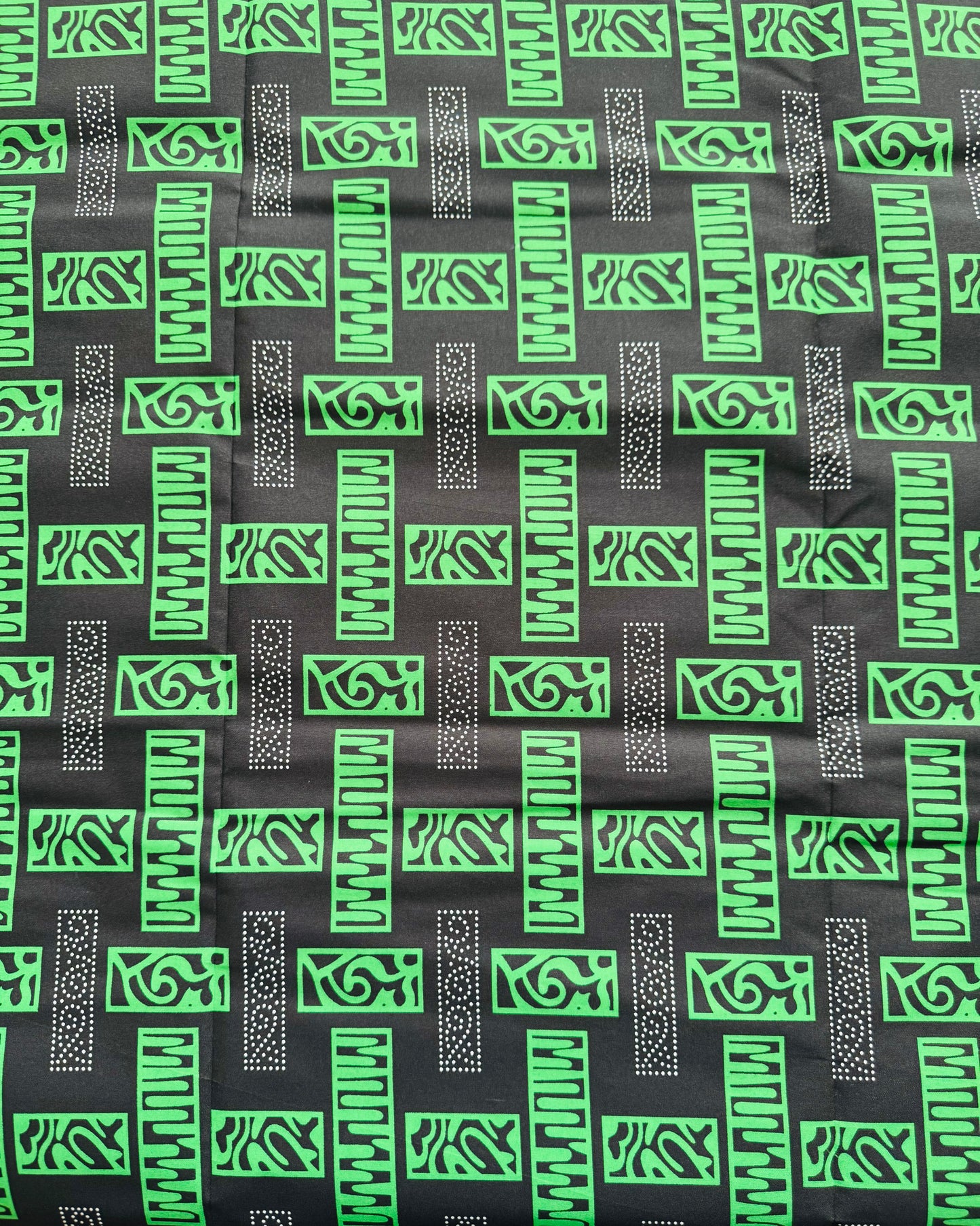 Patterned Fabric with Green and White Geometric Designs
